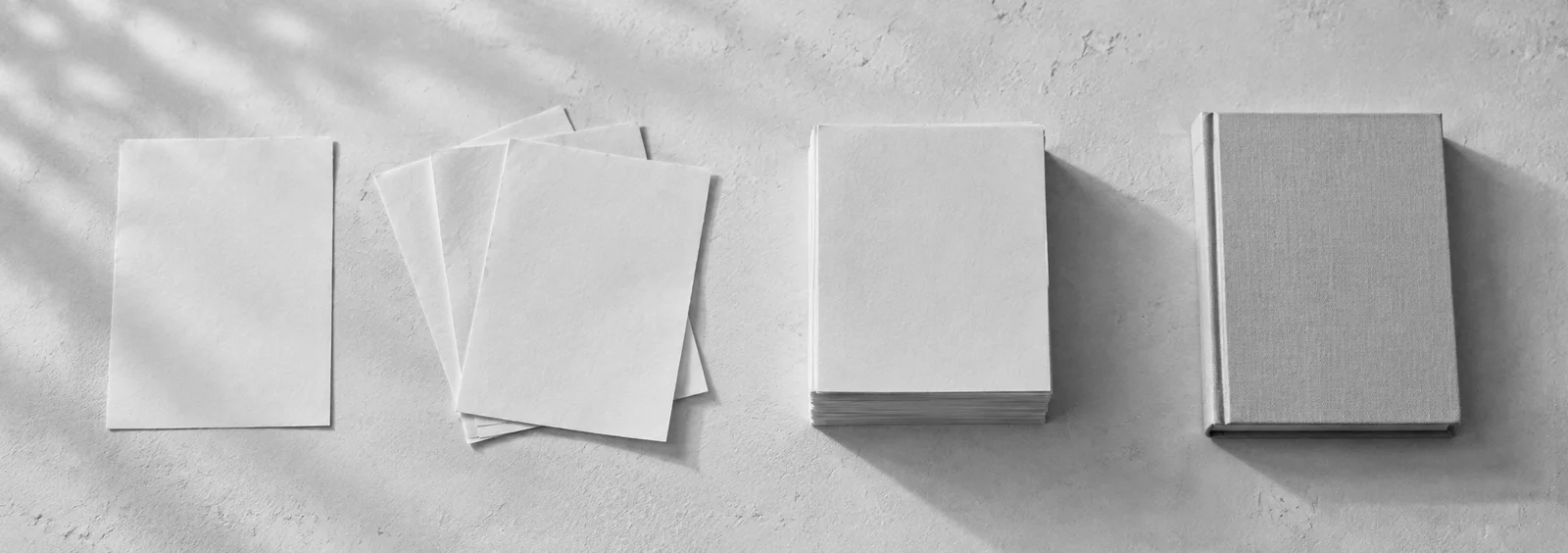 A single page becomes a few pages, a stack, and a cloth-bound book.